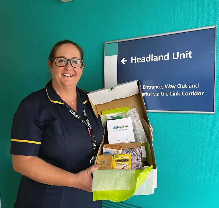 Specialist Oncology nurse Amy Byefield holding a box of kindness